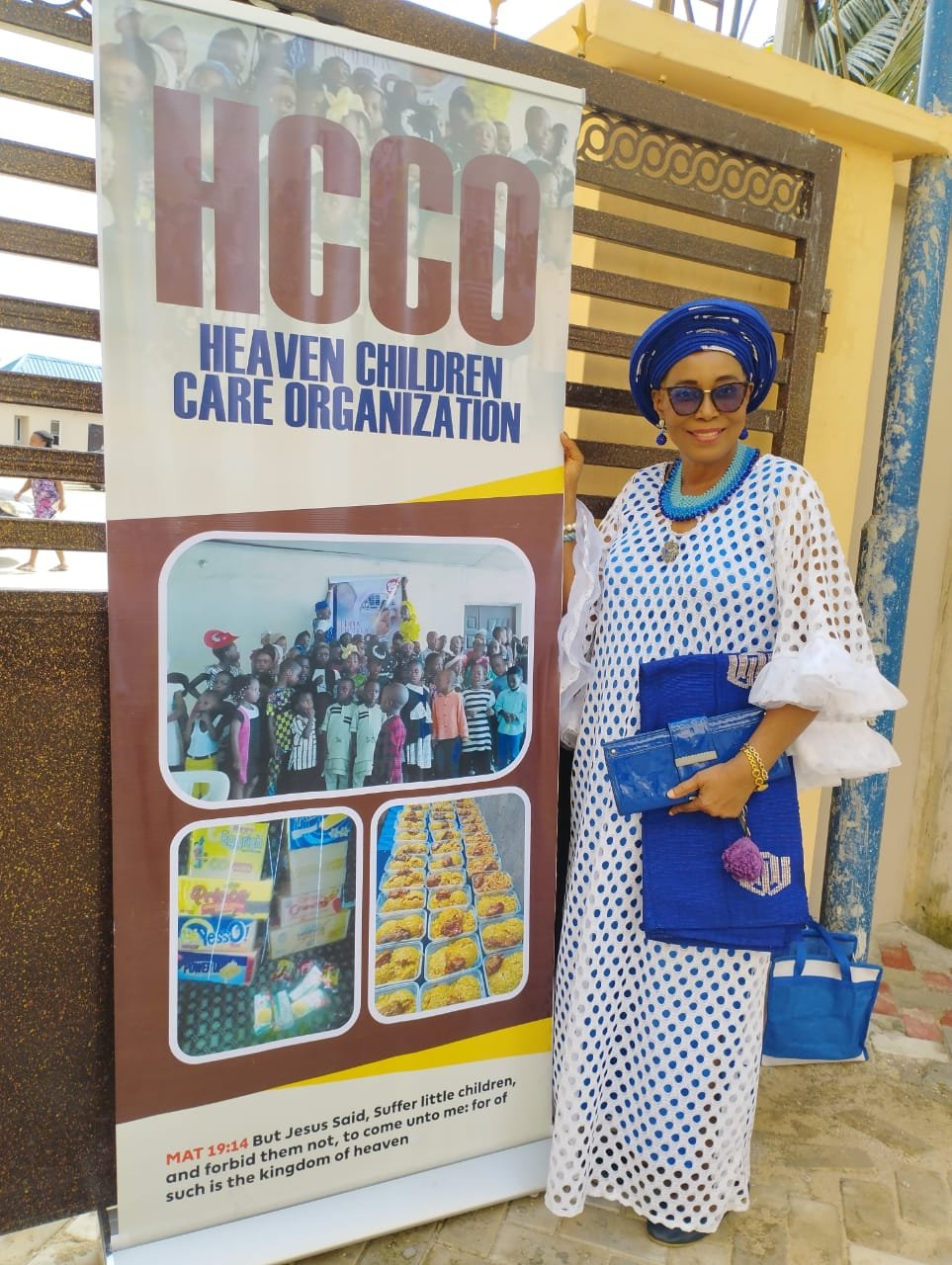 HCCO representative beside the organization's banner